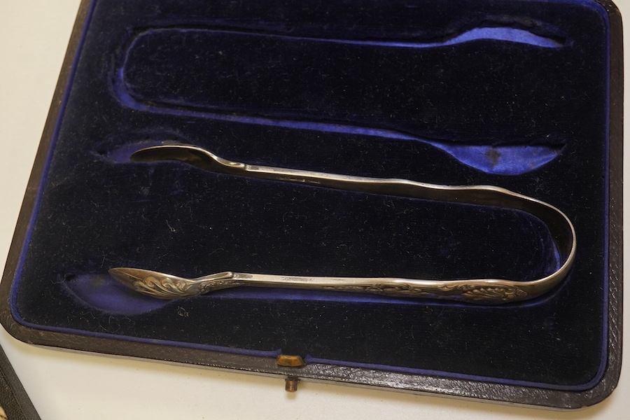 A French 800 standard white metal taste vin, 11cm, together with a George III silver toddy ladle, London, 1799, a cased set of six Art Nouveau silver coffee spoons by William Hutton & Sons and two incomplete cased silver